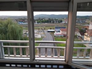 a view of a street from a window at apartman Dani in Derventa
