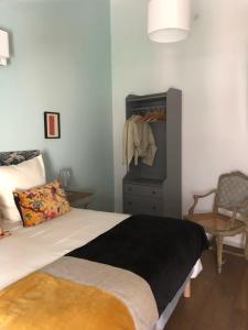Llit o llits en una habitació de Le Gite de Tassigny