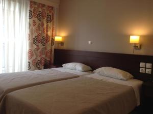Postel nebo postele na pokoji v ubytování Hotel Electra