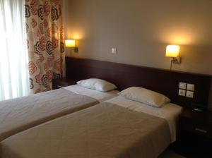Postel nebo postele na pokoji v ubytování Hotel Electra