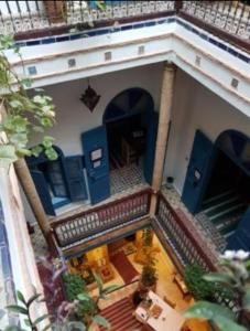 an overhead view of a building with blue doors at Riad Le Cheval Blanc in Safi