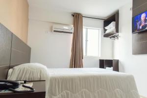 Cama ou camas em um quarto em CLH Suítes Foz do Iguaçu mais 33 fotos