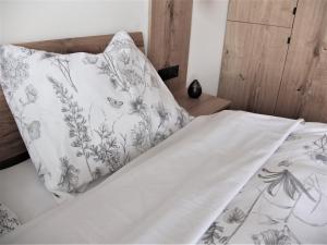 Postel nebo postele na pokoji v ubytování Apartmán Maco - Štrbské Pleso - Ovruč