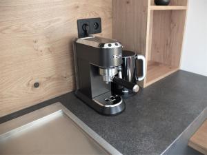 Příslušenství pro přípravu čaje a kávy v ubytování Apartmán Maco - Štrbské Pleso - Ovruč