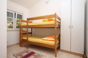 a bunk bed room with two bunk beds at Apartments with a parking space Kozjaca, Paklenica - 6565 in Šibuljina