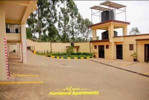 a building with a road in front of it at Luxe Furnished Apartments in Meru
