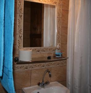 a bathroom with a sink and a mirror at Apartment4you Budapest in Budapest