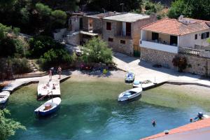 a group of boats are docked in the water at Apartments by the sea Basina, Hvar - 9673 in Vrbanj
