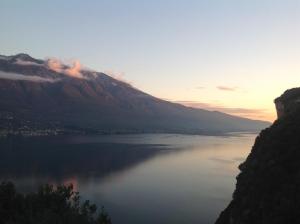 a view of a large body of water at sunset at Casa Bine in Tremosine Sul Garda