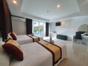 Postel nebo postele na pokoji v ubytování Retreat Resort Pattaya + 37 fotografií