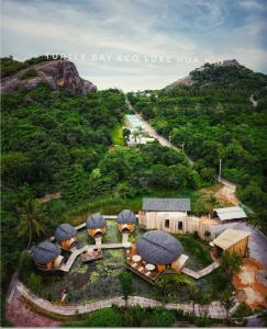an aerial view of a house with domes on a hill at Turtle Bay Eco Luxe Hua Hin in Khao Tao