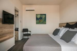 Postel nebo postele na pokoji v ubytování Skala Hotel