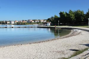 Fotografia z galérie ubytovania Family friendly apartments with a swimming pool Zadar - Diklo, Zadar - 16493 v destinácii Zadar