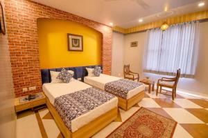 Letto o letti in una camera di Gems Suites-A Boutique Stay