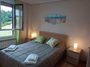Posteľ alebo postele v izbe v ubytovaní Fantástico apartamento en las playas de Suances