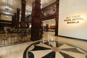 a lobby of a shopping mall with a star on the floor at Bayview Park Hotel Manila in Manila