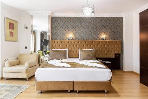 Postel nebo postele na pokoji v ubytování Kumru Hotel