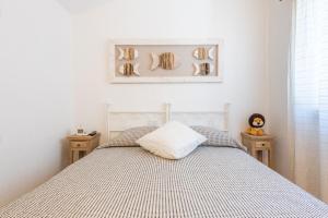 A bed or beds in a room at Casa Vacanza Il Bouganville