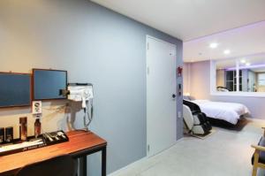 Krevet ili kreveti u jedinici u objektu Java Hotel