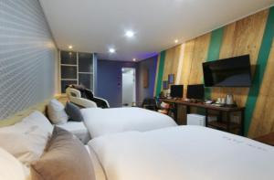 Krevet ili kreveti u jedinici u objektu Java Hotel