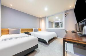 Krevet ili kreveti u jedinici u objektu Java Hotel