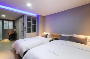 Krevet ili kreveti u jedinici u objektu Java Hotel