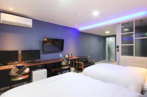 Krevet ili kreveti u jedinici u objektu Java Hotel