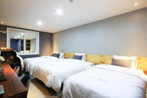 Krevet ili kreveti u jedinici u objektu Java Hotel