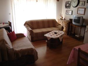 a living room with a couch and a coffee table at Apartment Kampor 5014b in Kampor