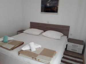 Postel nebo postele na pokoji v ubytování Apartment Barbat 5070b