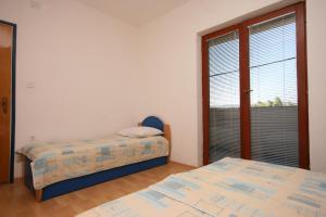 Posteľ alebo postele v izbe v ubytovaní Apartment Starigrad 6606b