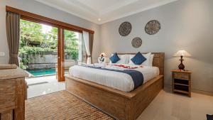 Postel nebo postele na pokoji v ubytování Ayu Sari Guesthouse by Mahaputra + 34 fotografií