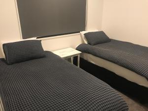 A bed or beds in a room at Long Bay Leisure