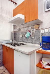 a kitchen with a sink and a counter top at Studio Selce 4801a in Selce