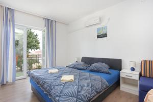 Posteľ alebo postele v izbe v ubytovaní Studio Tucepi 6695e