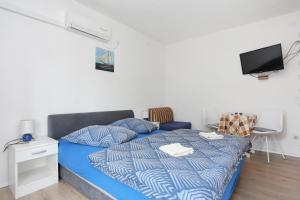 Posteľ alebo postele v izbe v ubytovaní Studio Tucepi 6695e