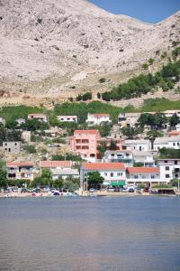 a town on the shore of a body of water at Double Room Metajna 6487d in Metajna