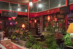 The Great Wall Courtyard Hostel tesisinde bir restoran veya yemek mekanı