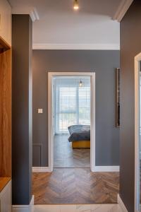 Postel nebo postele na pokoji v ubytování Apartmány pod Zámkom