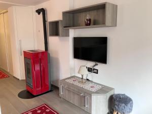 A television and/or entertainment centre at Dolomites Holiday Home