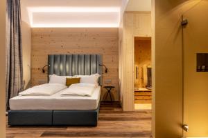 Säng eller sängar i ett rum på Calepina Alpine Suite