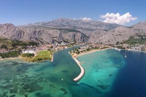 an aerial view of a beach in the water at Apartments with a parking space Omis - 14290 in Omiš