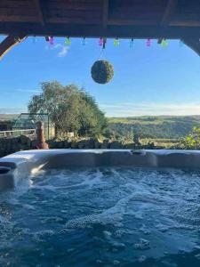 a jacuzzi tub with a view of the ocean at Inviting 4 Berth caravan in Hebden Bridge in Halifax