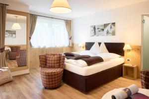 Rúm í herbergi á Hotel Comploj Adults only