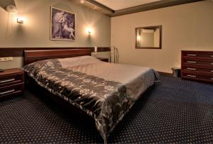 Voodi või voodid majutusasutuse Alex Hotel on Dybenko toas