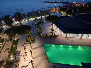 an overhead view of a swimming pool at night at Wonderful Sea View Apartment Qerret in Golem
