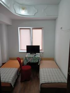 Posteľ alebo postele v izbe v ubytovaní IDEAL