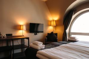 Postel nebo postele na pokoji v ubytování Braavo Spa Hotel