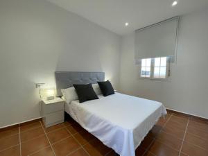 Postel nebo postele na pokoji v ubytování El Mirador del Coto, Apartamentos Living Sur + 16 fotografií