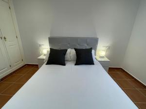 Postel nebo postele na pokoji v ubytování El Mirador del Coto, Apartamentos Living Sur